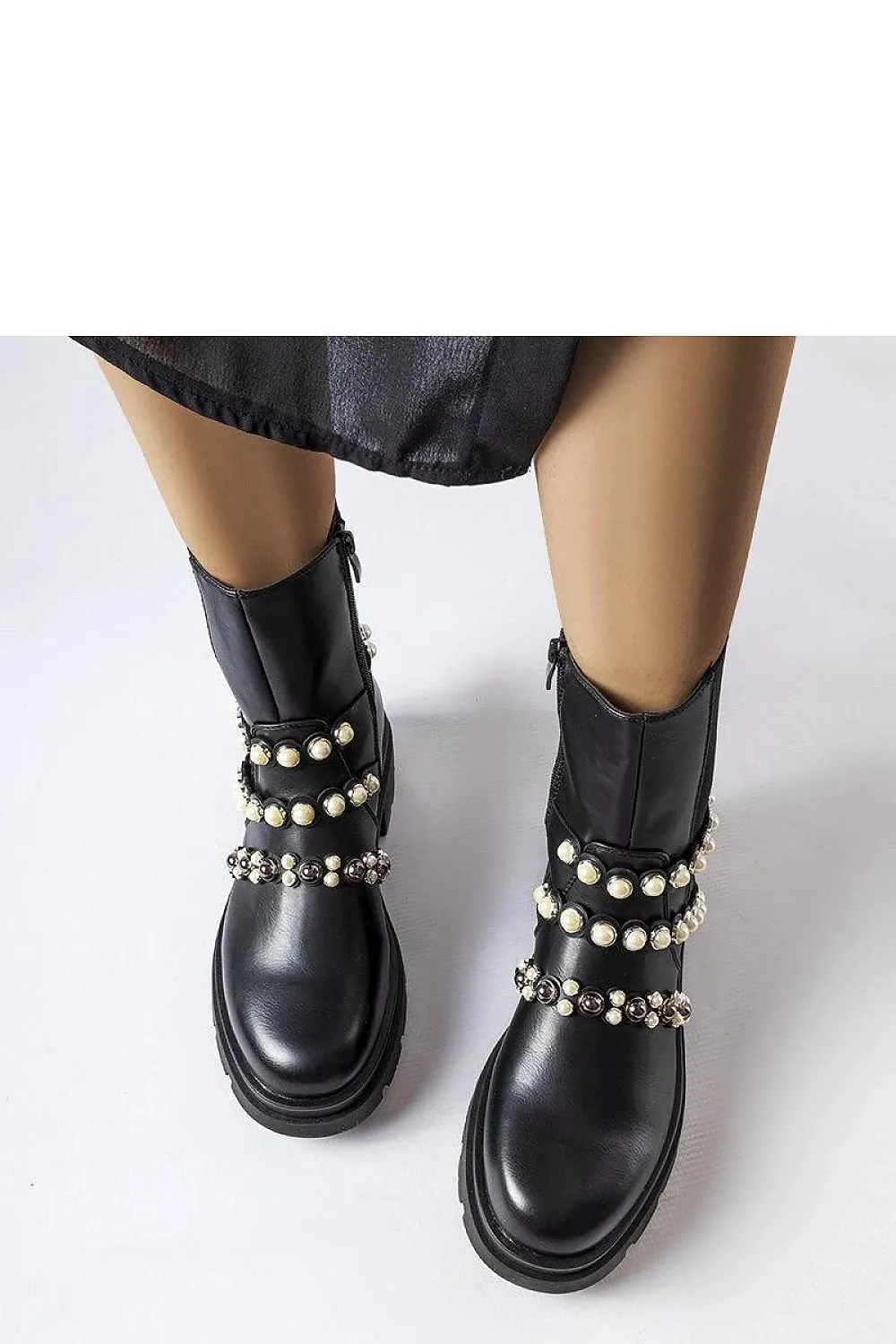 Beige ankle boots adorned with pearls